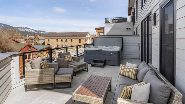Wrap around balcony with brand new hot tub, BBQ grill, luxury patio seating and loungers,  outdoor dining table for 8, 360 alpine views