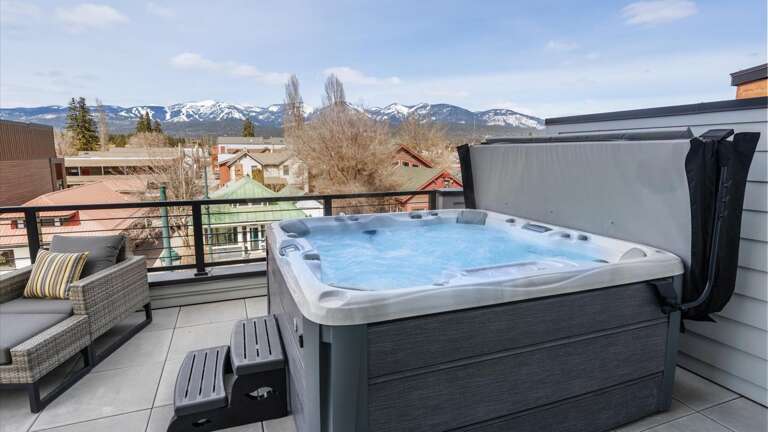 Wrap around balcony with brand new hot tub, BBQ grill, luxury patio seating and loungers,  outdoor dining table for 8, 360 alpine views