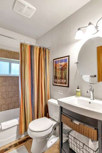 One of two full size bathrooms. This bathroom features a shower/tub combination, toilet, and vanity.