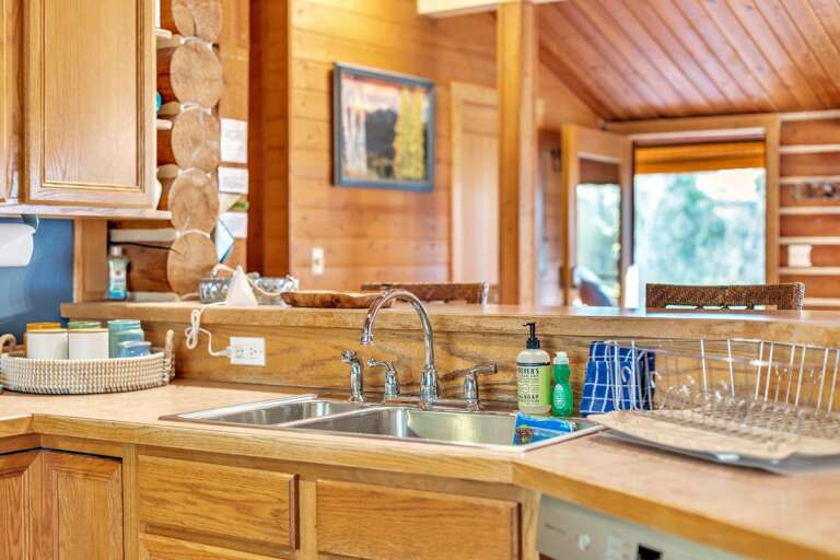 The fully stocked kitchen with all updated appliances and vaulted ceilings.