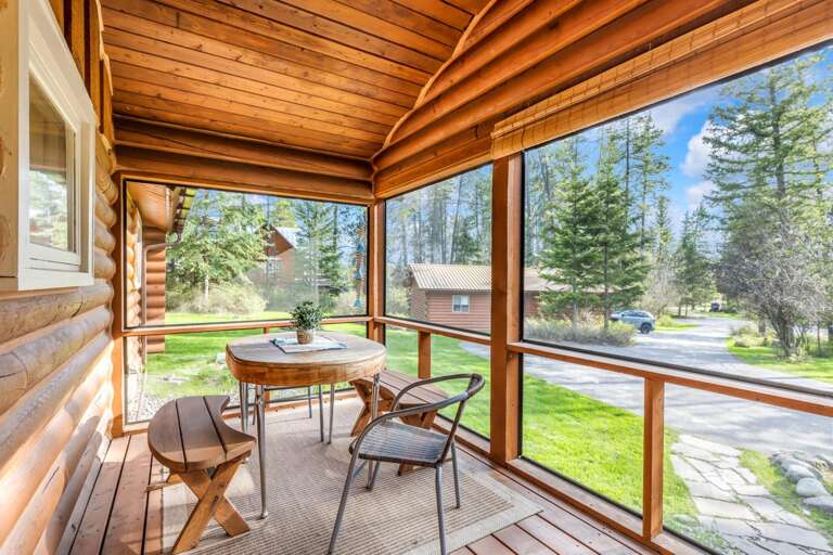 Screened in front porch with outdoor seating