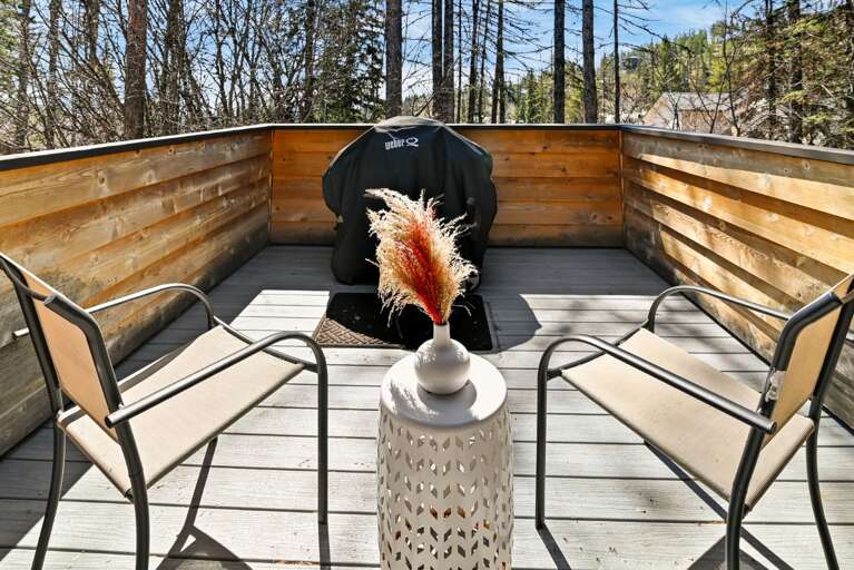 Deck with a gas grill (propane provided) and coming this summer- patio furniture set. Views of Great Northern Peak right from the patio.