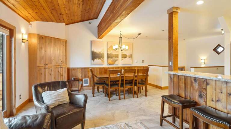 Open concept kitchen, dining area, living room, and walk out patio.