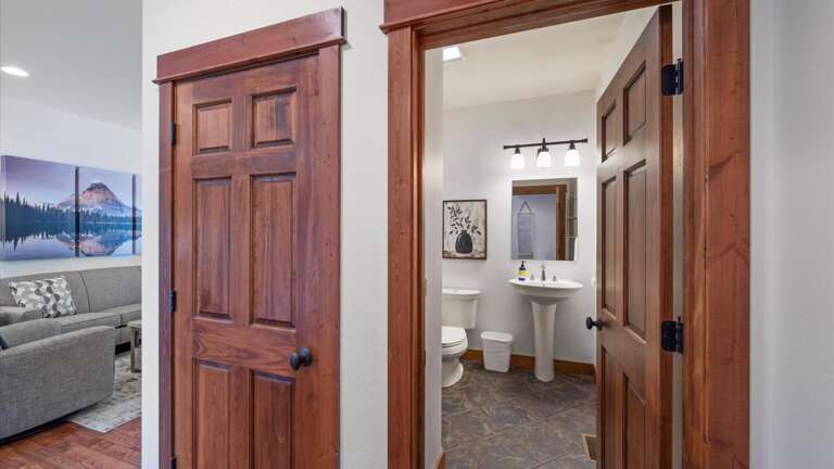 Entry from the garage features  a half bathroom and coat closet.