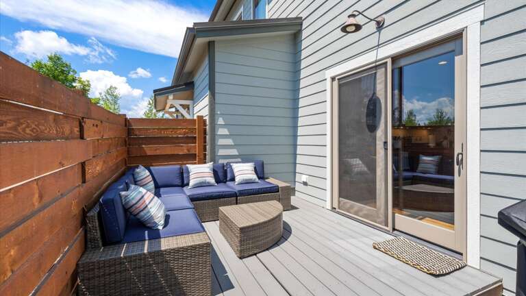The outdoor space features a comfy seating area to enjoy your morning cup of coffee, gas grill to BBQ and dining table to enjoy a great meal on the deck.