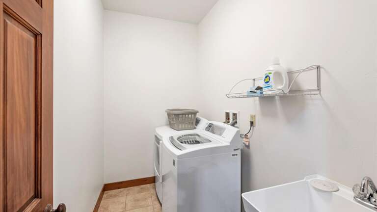 The upstairs laundroom features a  state of the art washer