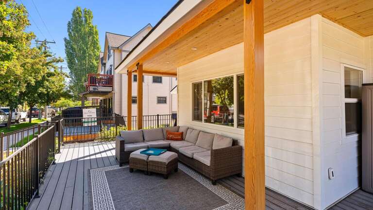 Wrap around porch with seating and dining area.