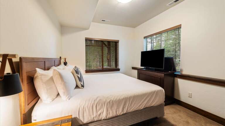 Downstairs King Room #1 includes luxury mattress and linens, large closet, alpine views, and an elevator TV.