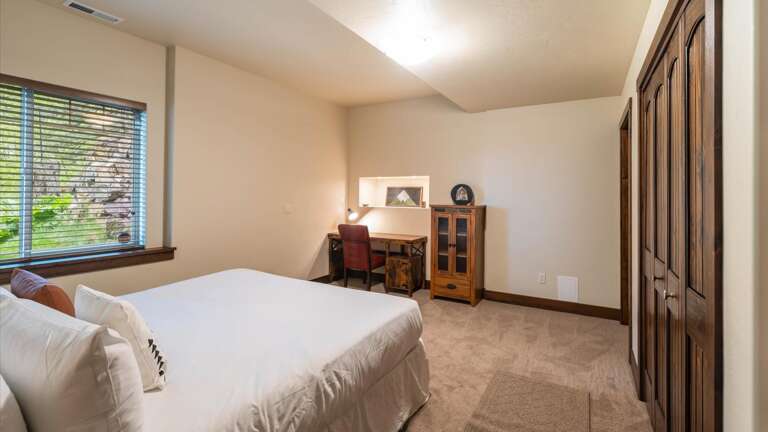 Downstairs King Room #2 includes a Sleep Number adjustable mattress and luxury linens, a desk and chair for our work from home guests, and a large closet.
