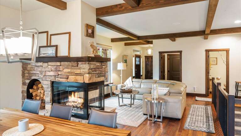 View of main floor open concept space from the dining area into the living room.