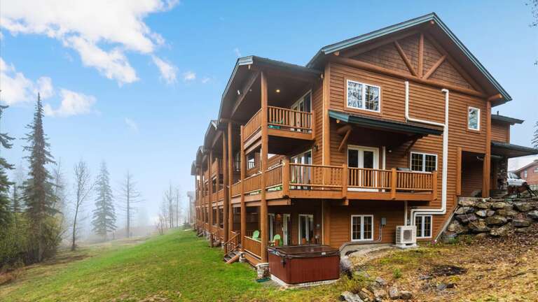 Backside of the property- corner townhome right on the slopes, 3 stories with private hot tub
