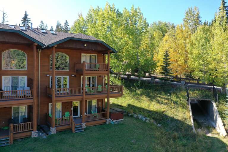 Backside of the property- corner townhome right on the slopes, 3 stories with private hot tub