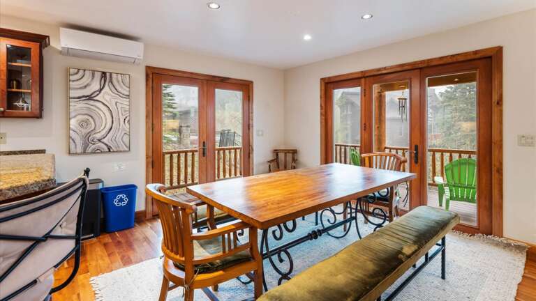 Dining area with seating up to twelve with wrap around balcony  with views of the slopes.
