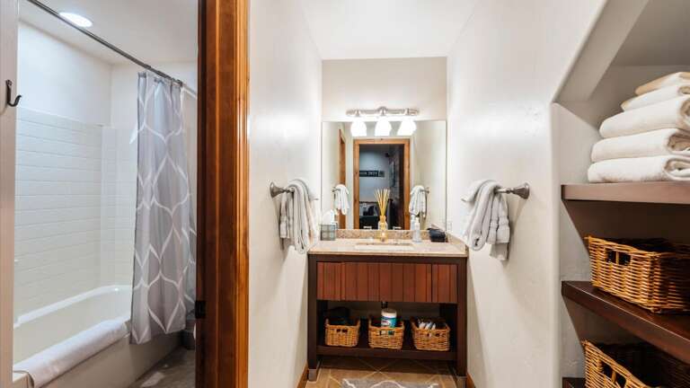 Lower level bathroom with lockable door to toilet and shower/tub combination