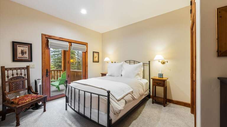 Lower level queen room with French doors out to deck with hot tub, luxury mattress, and closet.
