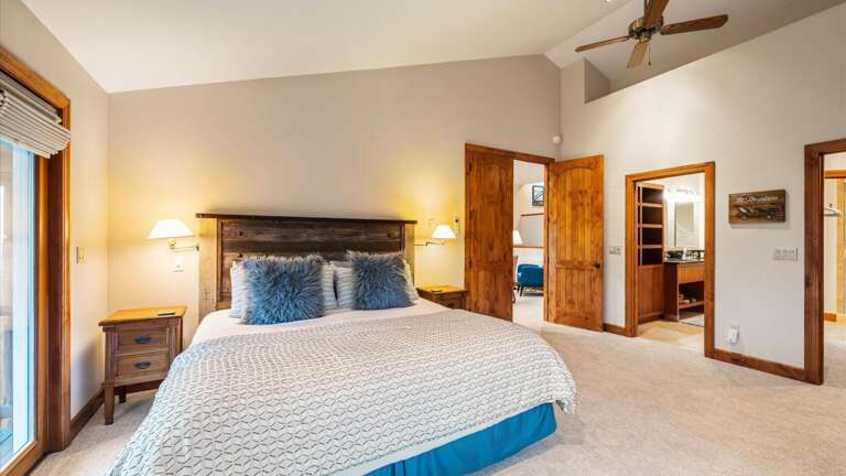 Master Bedroom with luxury king mattress, flat screen smart TV, walk-in closet, French doors to private balcony