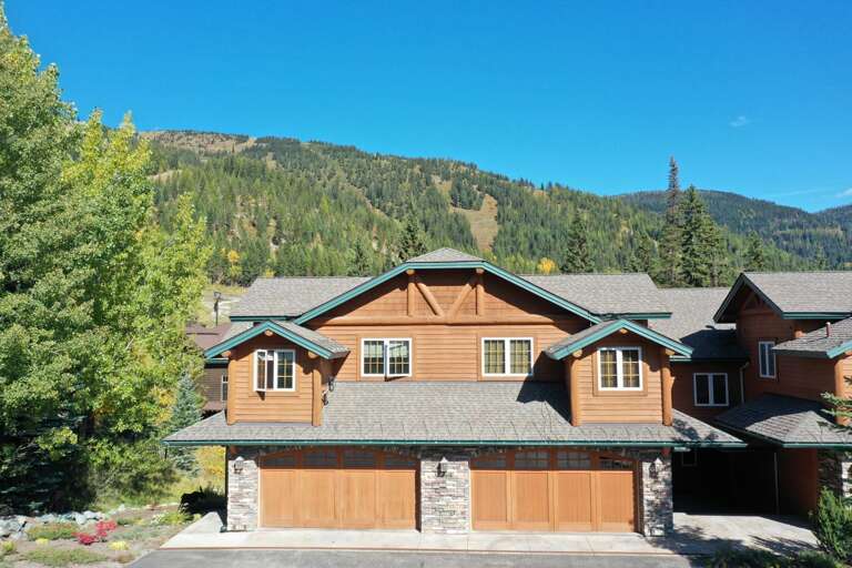 View of front of property during summertime with view of the slopes
