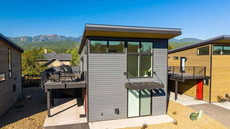 Exterior view of The Bison at The Quarry showcasing the view of Big Mountain (Whitefish Mountain Resort)
