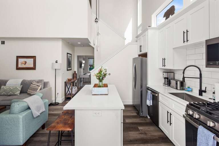 Fully stocked kitchen with both a drip pot coffee maker and keurig.