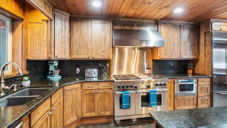 The fully stocked kitchen features all the cookware, appliances, and amenities one would need to cook any meal! Not to mention lake views while cooking!