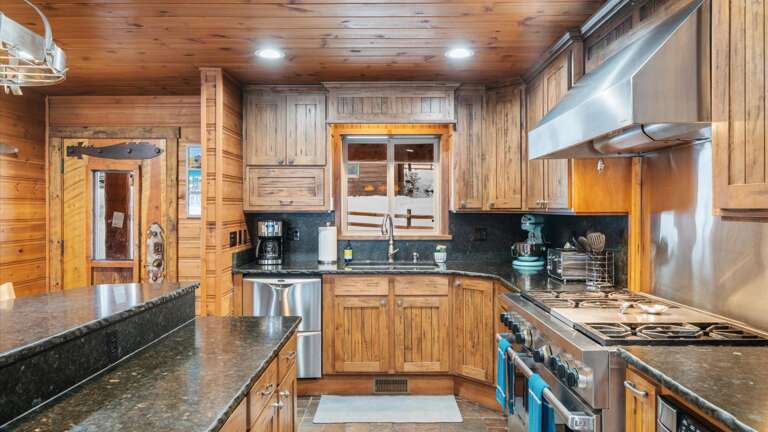 The fully stocked kitchen features all the cookware, appliances, and amenities one would need to cook any meal! Not to mention lake views while cooking!