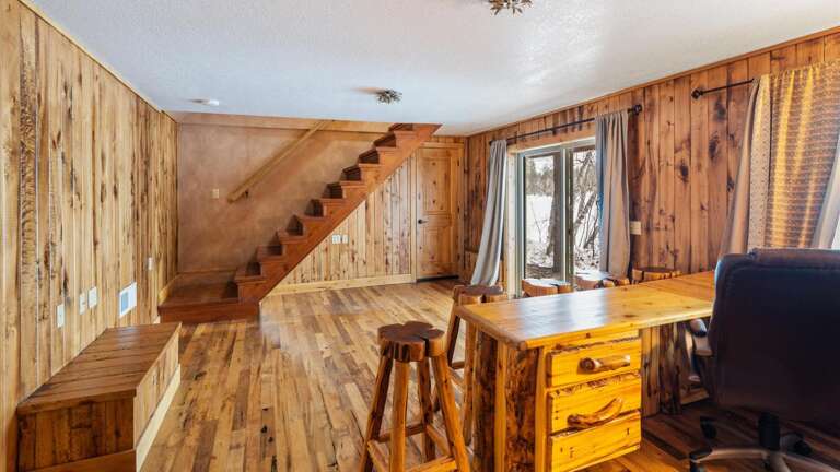 The lower level features an office for our work from home guests! This office also features a sliding door that puts you just steps from the lake!