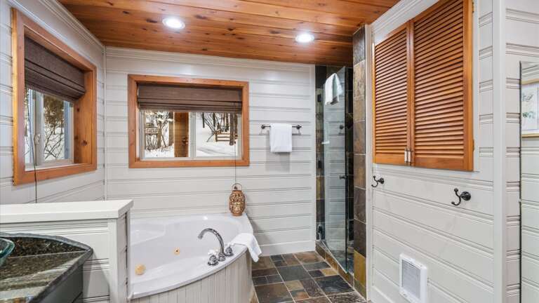The master ensuite bathroom features his and her vanity, jetted soaking tub, walk-in shower,