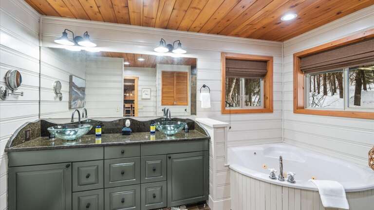 The master ensuite bathroom features his and her vanity, jetted soaking tub, walk-in shower,