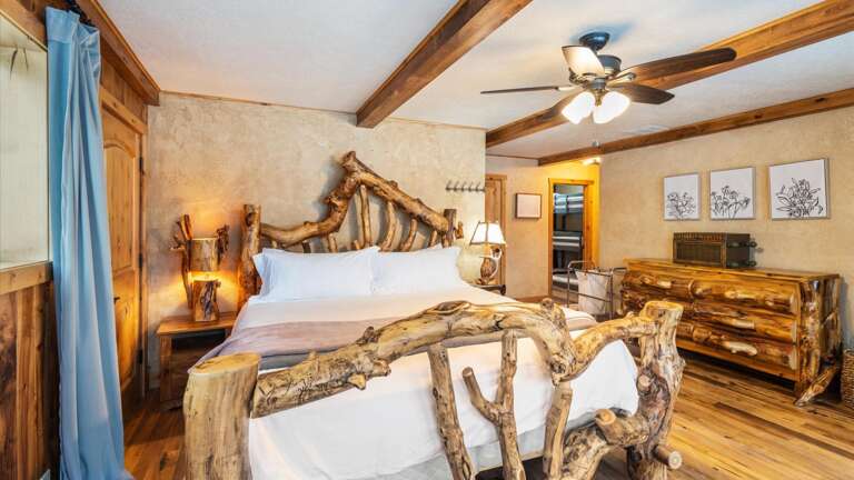 The upstairs master suite features lake views from the comfort of this California King bed, a walk-in closet,