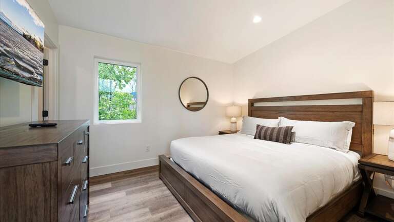 The guest bedroom features a  luxury king mattress and top of the line linens, HDTV with streaming capabilities and cable, large closet, and ensuite bathroom.