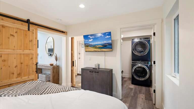 Master bedroom with luxury king mattress and top of the line linens, HDTV with streaming capabilities and cable, walk-in closet, and ensuite bathroom.