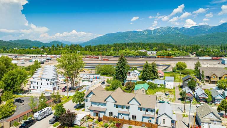 Aerial view of the property featuring the close proximity to the Whitefish River and downtown Whitefish.