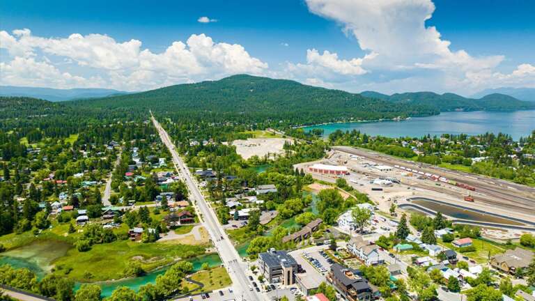 Aerial view of the property featuring the close proximity to the Whitefish River and downtown Whitefish.