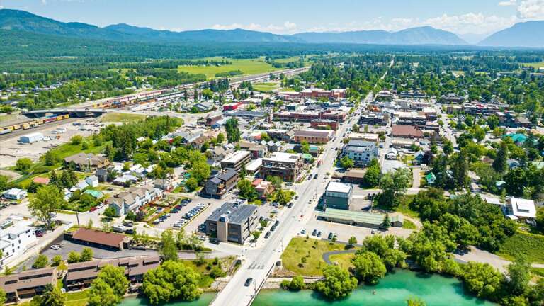 Aerial view of the property featuring the close proximity to the Whitefish River and downtown Whitefish.