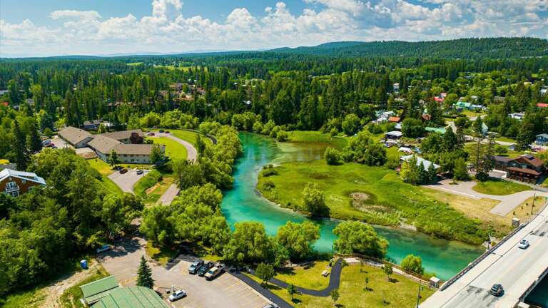Aerial view of the property featuring the close proximity to the Whitefish River and downtown Whitefish.