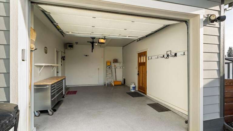 Attached heated garage as well as driveway parking space