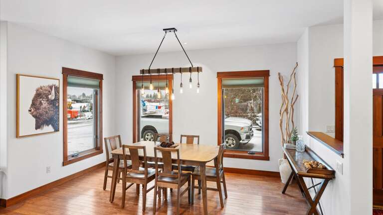 The dining area is neatly tucked into a window-surrounded enclave which provides gorgeous natural lighting throughout the day,