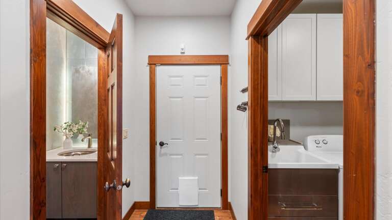 Laundry room on the right, half bath on the left, and entry into the garage.
