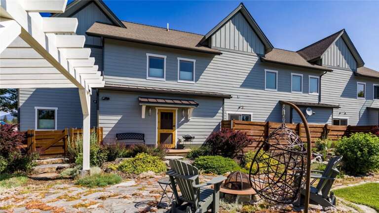 Step outside into the large private backyard area which features a brand new 6-person hot tub under a pergola wrapped in mood-setting string lights along with a gas grill and firepit seating area.