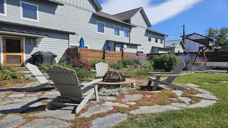 Step outside into the large private backyard area which features a brand new 6-person hot tub under a pergola wrapped in mood-setting string lights along with a gas grill and firepit seating area.
