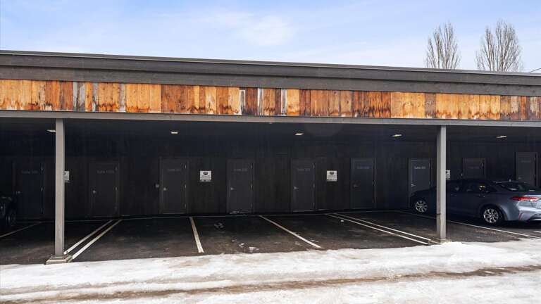Covered parking in the carport located in the back of the building
