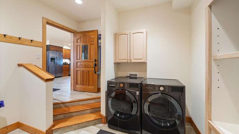 Main floor laundry room with beach towels provided and tons of storage for ski