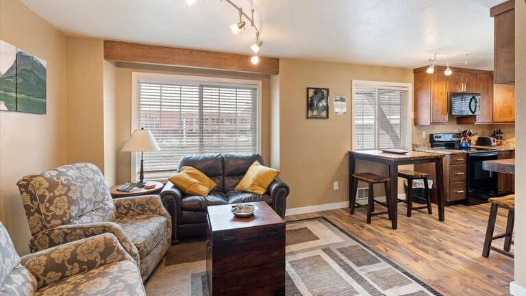 Open concept living room, dining space, and kitchen.