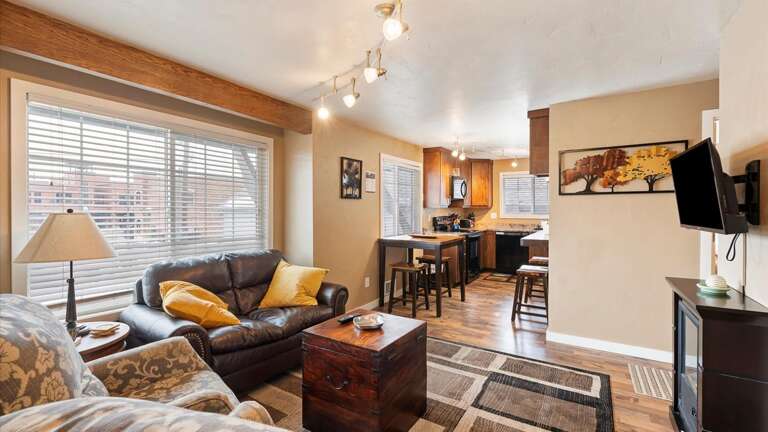 Open concept living room, dining space, and kitchen.