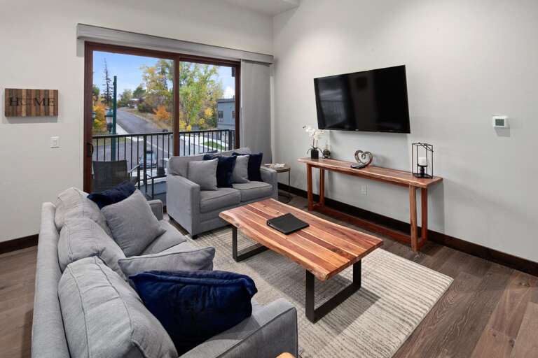 Cozy up in the wonderful living room with a luxury queen sofa sleeper, HDTV with streaming