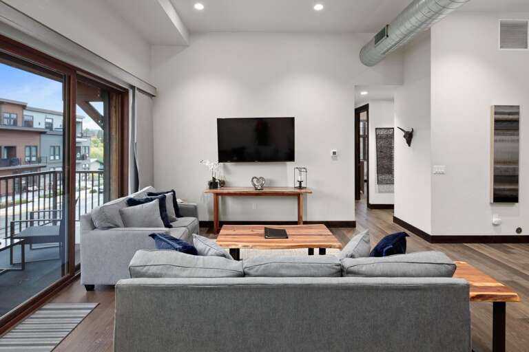 Cozy up in the wonderful living room with a luxury queen sofa sleeper, HDTV with streaming