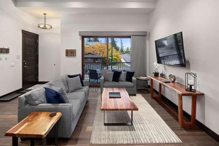 The grand room features an open concept living, dining, and kitchen area.