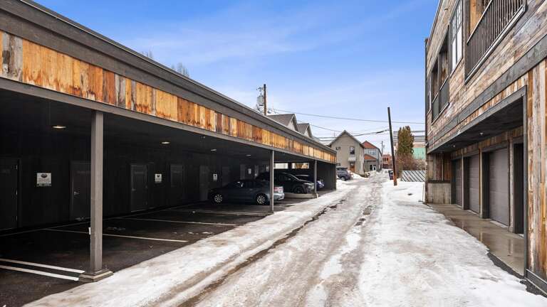 View of the alley to access the designated covered parking spot.