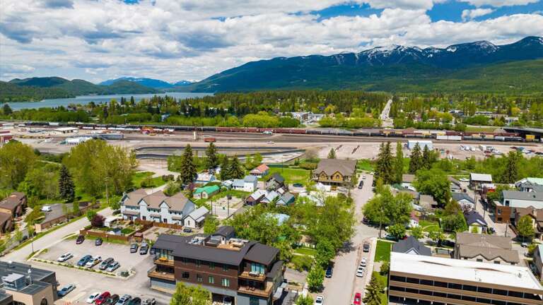 Aerial view of the building showcasing the location in downtown Whitefish and the close proximity to Whitefish Mountain Resort and Whitefish Lake.