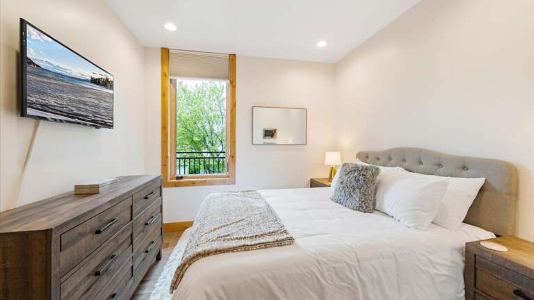 Junior master bedroom includes a luxury queen mattress and linens, HDTV with streaming capabilities, closet